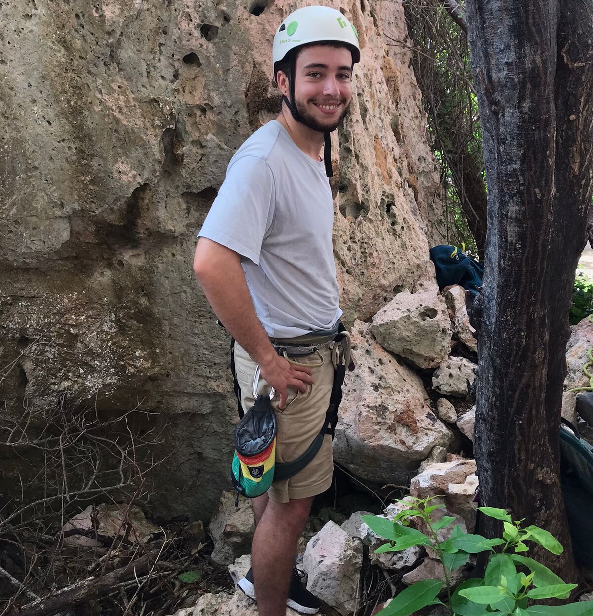 Arjen de Aldrey in climbing gear beside a rock face.